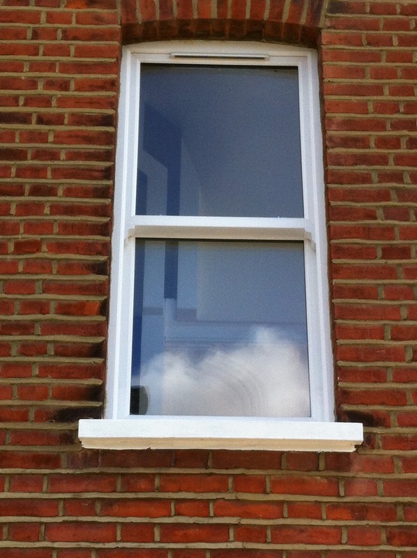 uPVC sash window on Victorian red brick house in Uxbridge